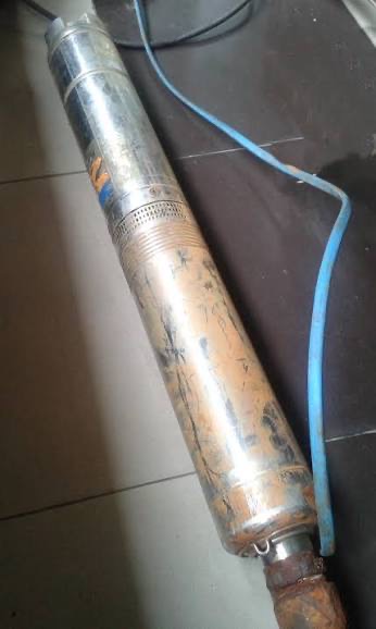 Extracted submersible bore pump with iron staining and sediment wear after being pulled for inspection by Mayfair Plumbing in Adelaide
