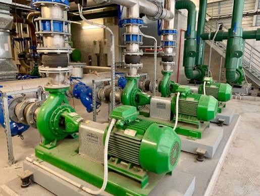 Industrial pump room with multiple motor-driven pump sets and process pipework used in water treatment facilities