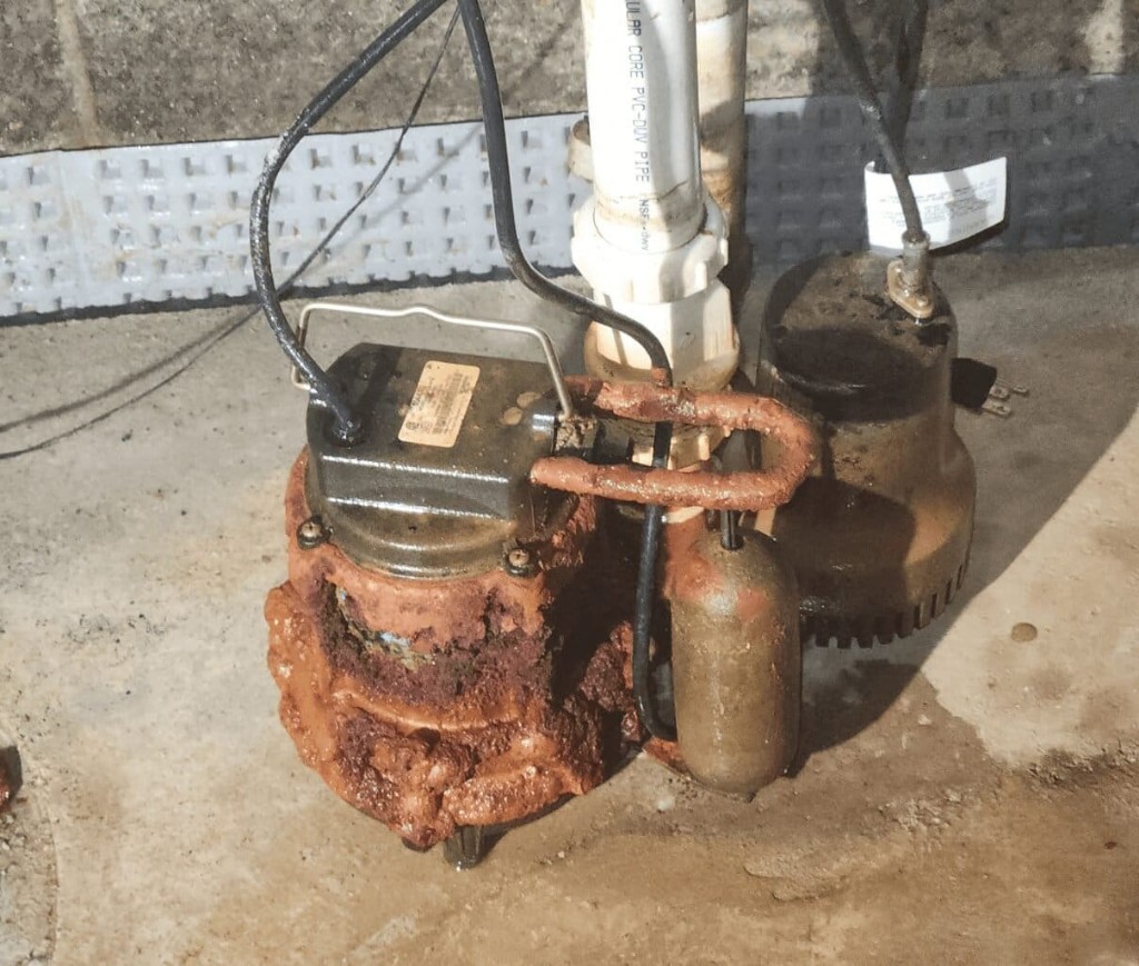 Corroded sump pump showing why regular pump servicing is essential